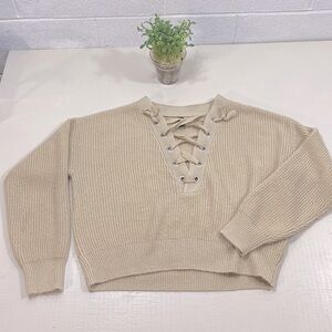 Dividend H&M tan coloured knitted sweater with laced up front​​​​​​​​​​​…​​
